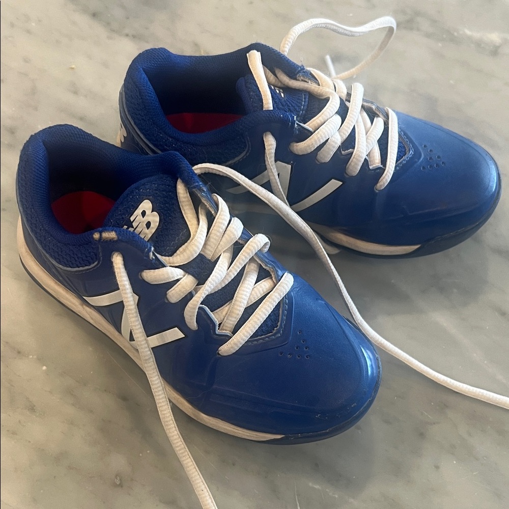 New Balance Kids Blue and White Cleats